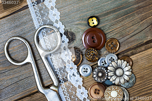 Image of vintage buttons, lace, and a dressmaker scissors