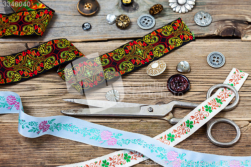 Image of vintage buttons, lace, and a dressmaker scissors