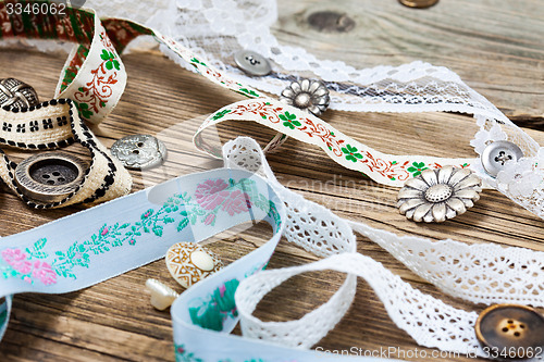 Image of ribbons, lace, tape and buttons