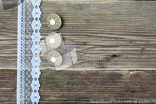 Image of three vintage button and lace tape