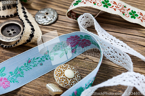 Image of vintage ribbons, lace, tape and buttons