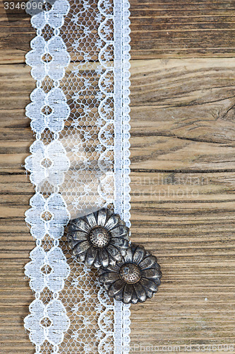 Image of vintage button and lace tape