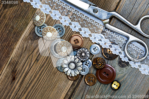 Image of vintage buttons, lace, and a dressmaker scissors
