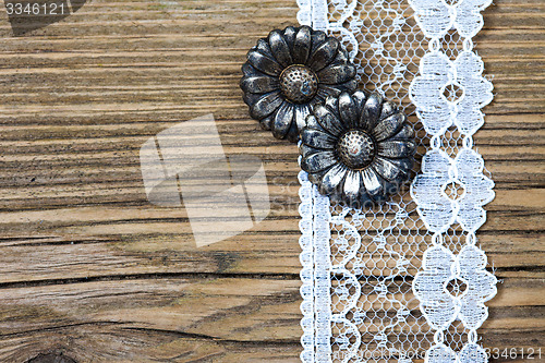 Image of vintage metal buttons flowers and lace tape