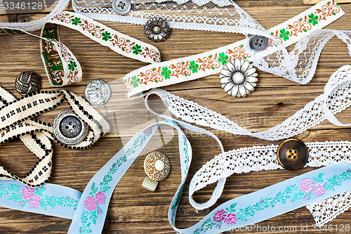 Image of vintage buttons, lace, tape and ribbons
