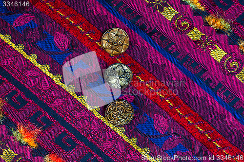 Image of vintage band with embroidered ornaments and old buttons