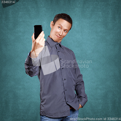 Image of Asian Man Making A Selfie