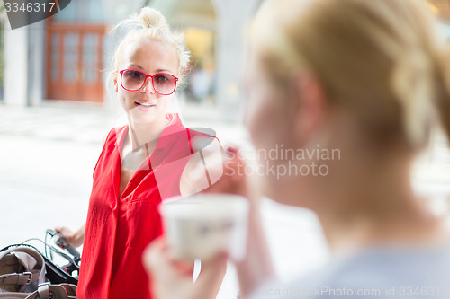 Image of Female friends enjoying a conversation.