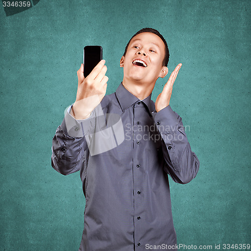 Image of Asian Man Making A Selfie
