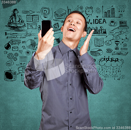 Image of Asian Man Making A Selfie
