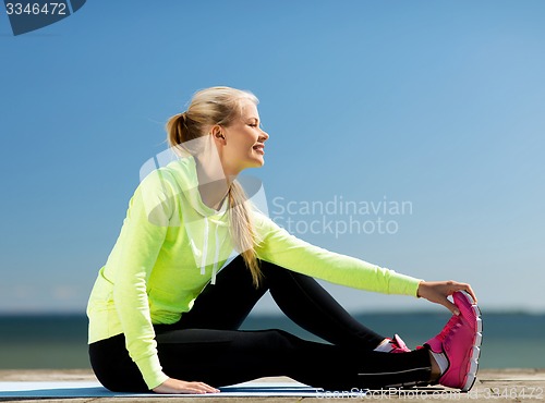 Image of woman doing sports outdoors