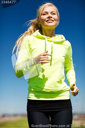 Image of woman jogging outdoors