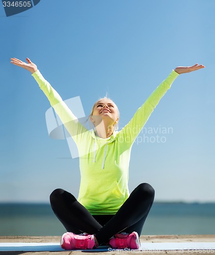 Image of woman doing yoga outdoors