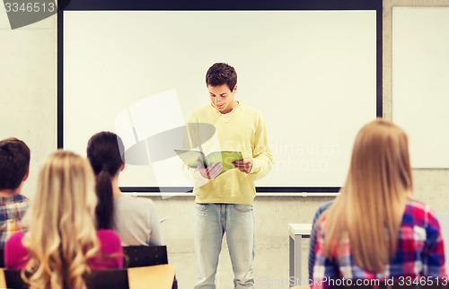 Image of group of smiling students in classroom