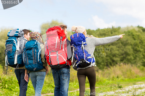 Image of group of friends with backpacks hiking