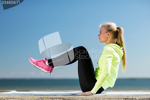 Image of woman doing sports outdoors