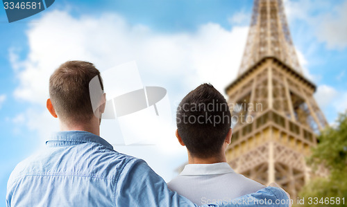Image of close up of male gay couple over eiffel tower