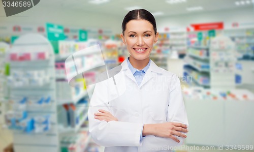 Image of young woman pharmacist drugstore or pharmacy