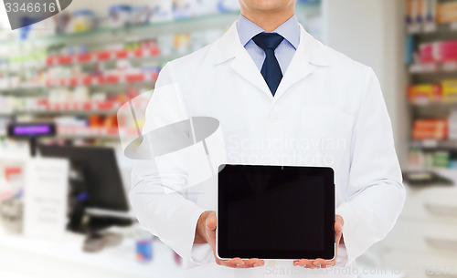 Image of male doctor with tablet pc at drugstore