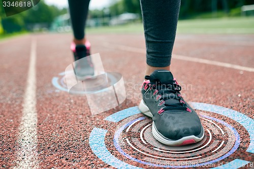 Image of close up of woman feet running on track