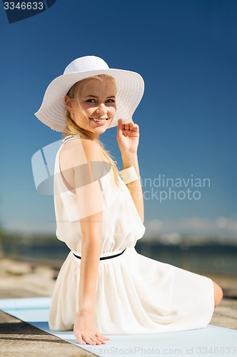 Image of beautiful woman enjoying summer outdoors