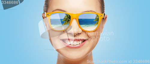 Image of happy teenage girl in sunglasses