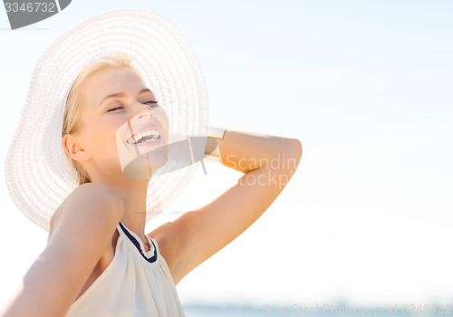 Image of beautiful woman enjoying summer outdoors