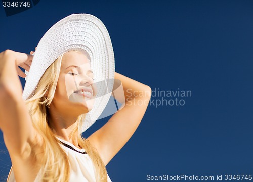 Image of beautiful woman enjoying summer outdoors