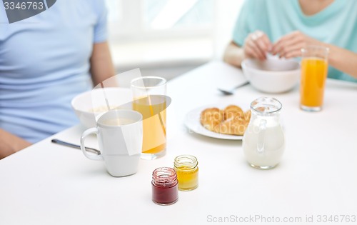 Image of close up of couple having breakfast at home