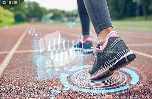 Image of close up of woman feet running on track