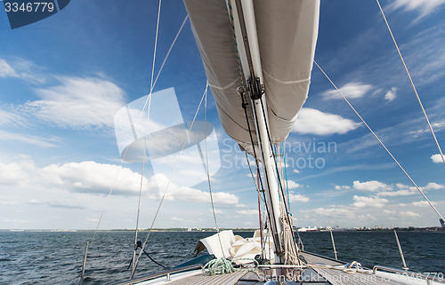 Image of close up of sailboat mast or yacht sailing on sea