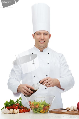 Image of happy male chef cook cooking food
