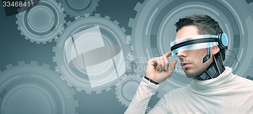 Image of man with futuristic 3d glasses and sensors