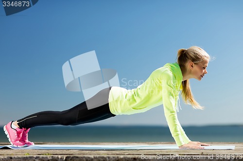 Image of woman doing sports outdoors