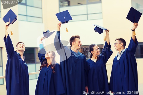 Image of group of smiling students in mortarboards