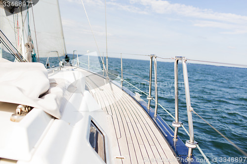 Image of close up of sailboat or sailing yacht deck and sea