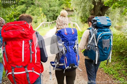 Image of group of friends with backpacks hiking