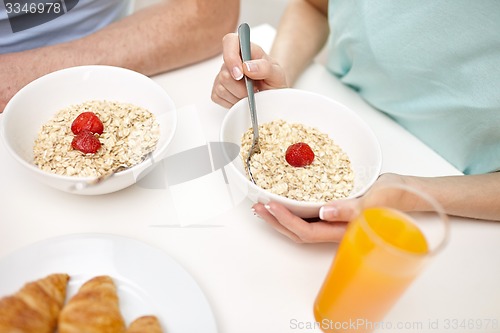 Image of close up of couple having breakfast at home