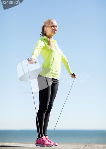 Image of woman doing sports outdoors