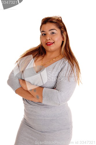 Image of Woman standing with her arms crossed.