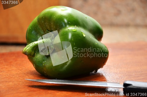 Image of Fresh pepper with knife