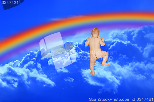 Image of baby climbs to the blue heaven with rainbow