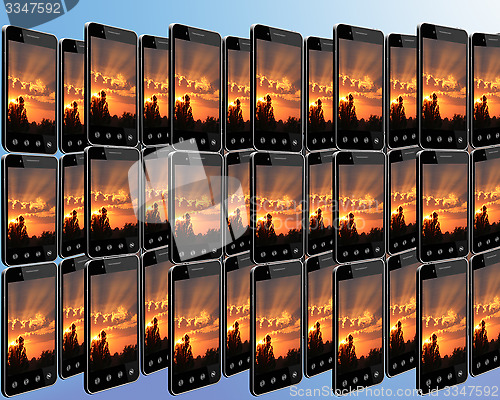 Image of smart-phones with sunset in rows
