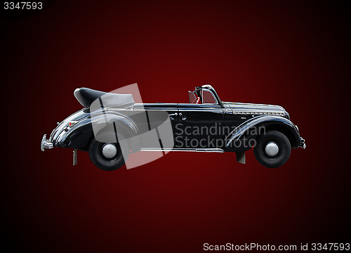 Image of retro car isolated on the dark background