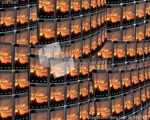 Image of smart-phones with sunset in rows