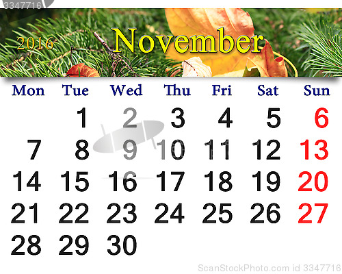 Image of calendar for November 2016 with yellow leaf on the spruce