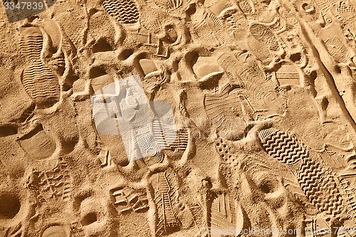 Image of footwear prints on sand