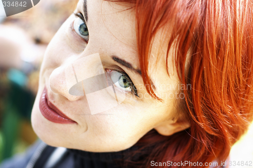 Image of a young happy red-haired women