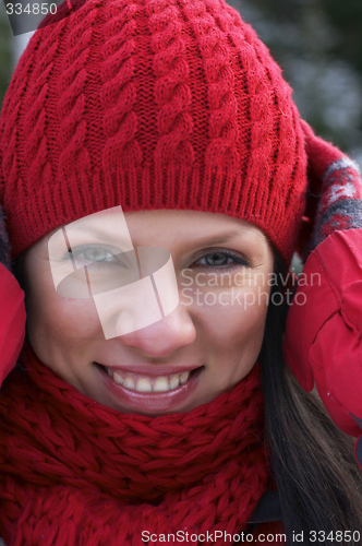 Image of young beautiful woman in a red cup