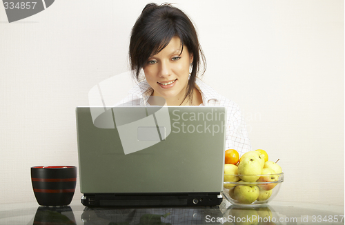 Image of beautiful woman with laptop chair over white